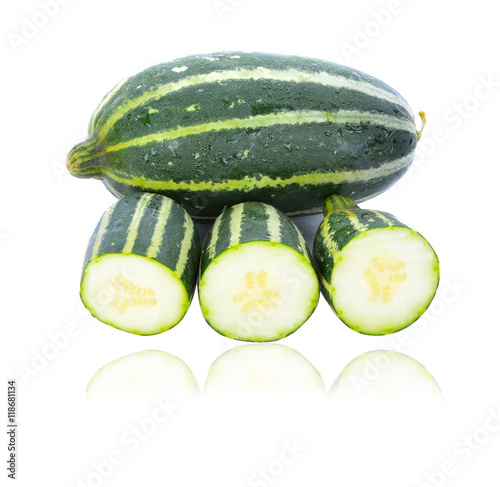 Cantaloupe melon (Cucumis melon) young on white background.