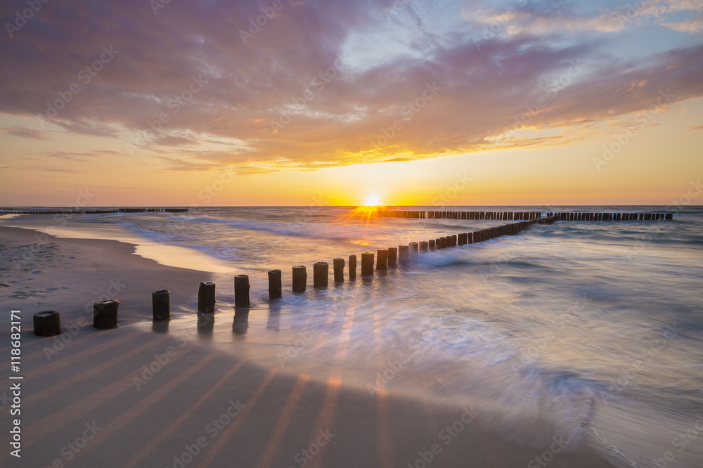 Sea landscape at sunset, sandy beach and cliff,waves breaking on the shore
Sea landscape at sunset, sandy beach and cliff,waves breaking on the shore