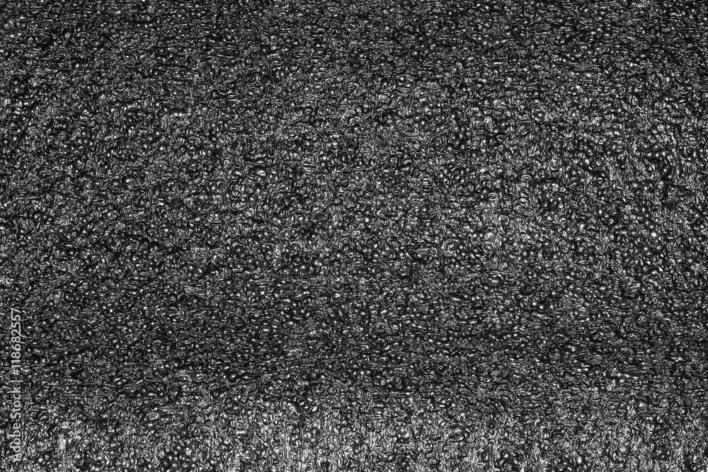 Black plastic foam texture or plastic foam background for design. Stock