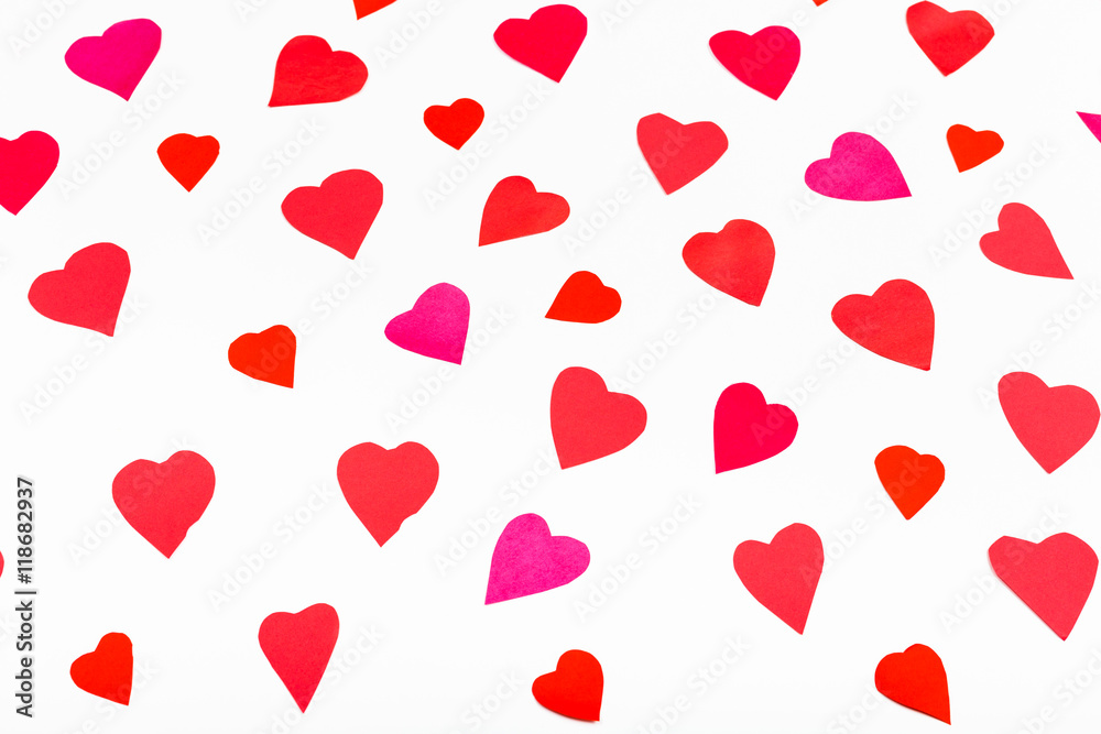 pink and red hearts cut out from paper on white