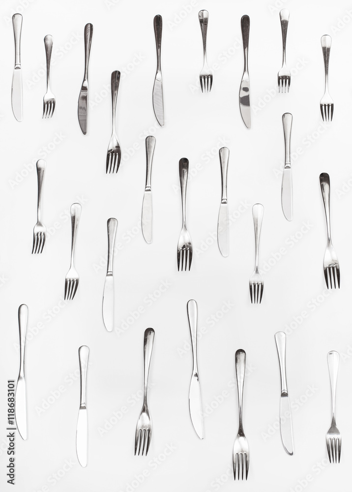 vertical set of table knives and forks on white vertical set of table knives and forks on white