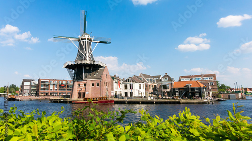 Old mill Adriaan and Spaarne river panorama in Haarlem, Holland, Netherlands