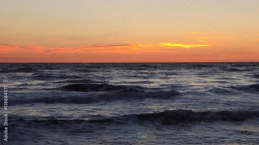 Waves on sandy beach at sunrise. Italian coastline. Waves on sandy beach at sunrise. Italian coastline.