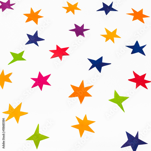 various stars carved from colored paper on white