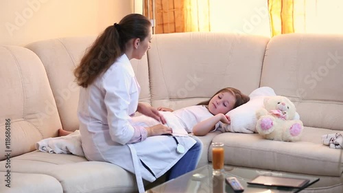 doctor examines a child