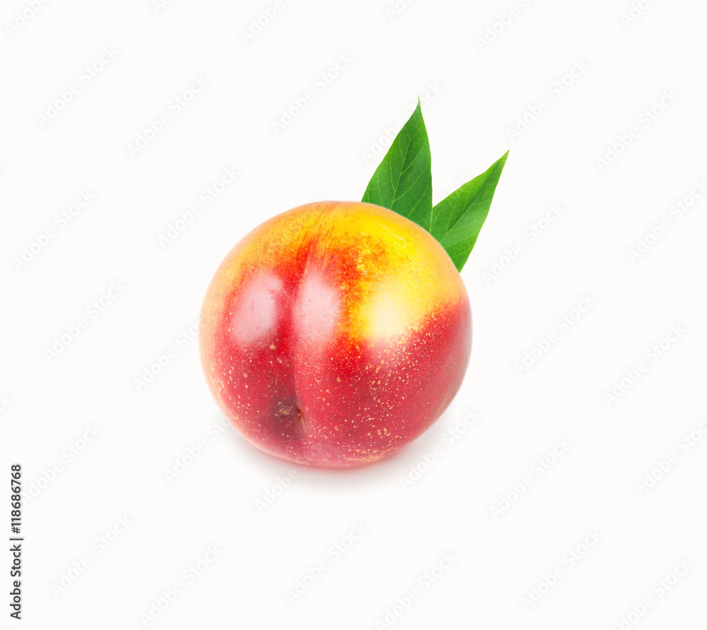Single peach with leaves on a white background Single peach with leaves on a white background