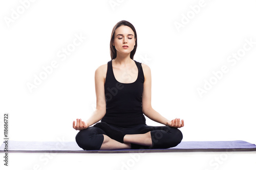 Girl is engaged in yoga on a white background, concept of health