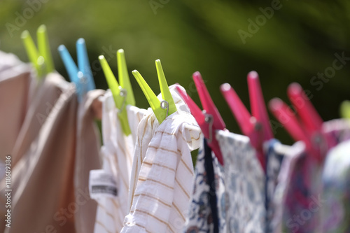 Clothes hung out to dry on a washing line photo