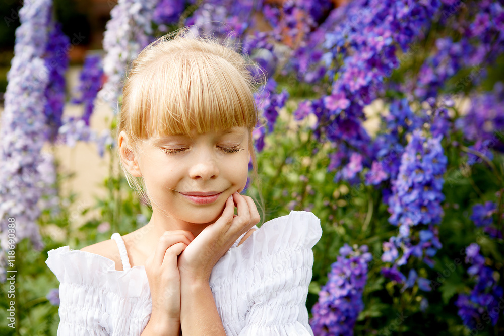Portrait of beautiful little girl in white dress on the nature Portrait of beautiful little girl in white dress on the nature