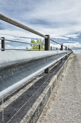 Safety metal guardrail on a rural roadside