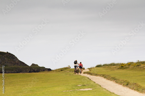 Cyclists on a costal path in Cornwall