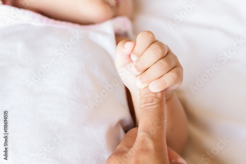 Small delicate little hand of newborn - close portrait