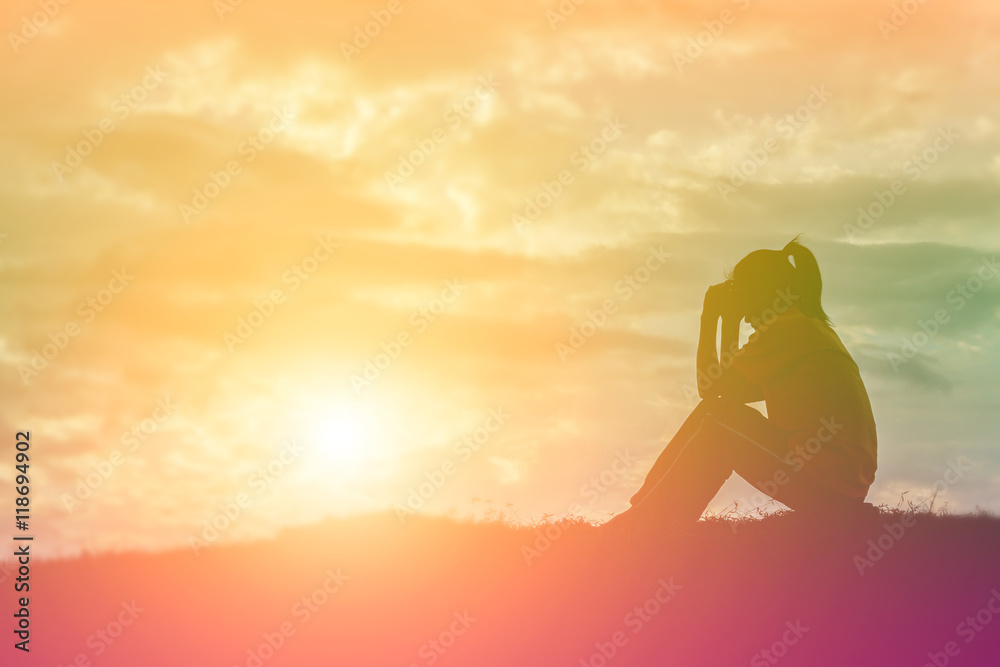 Sad and depressed woman sitting alone Stock Photo | Adobe Stock