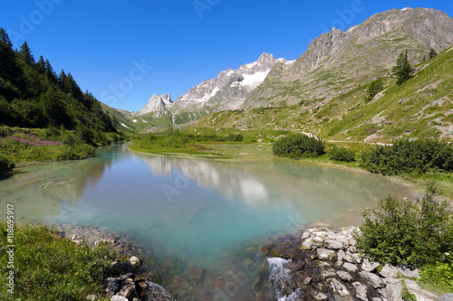 Green Combal lake and mountain landscape