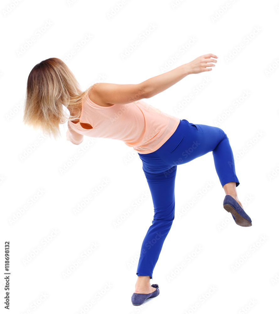 Balancing young woman. or dodge falling woman. Rear view people collection. backside view of person. Isolated over white background. The blonde in a pink t-shirt falls on its side. Balancing young woman. or dodge falling woman. Rear view people collection. backside view of person. Isolated over white background. The blonde in a pink t-shirt falls on its side.