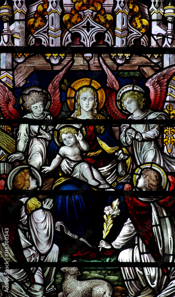 Mary with baby Jesus and four angels in stained glass