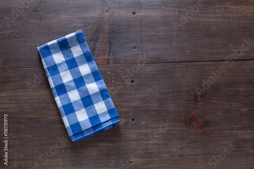 Wood Table Background With Blue Cloth Napkin.