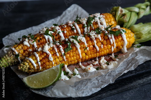 mexican grilled corn, elote, dark photo