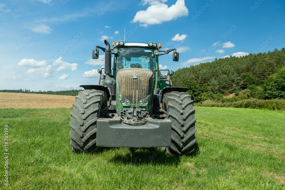 Tractor with cultivator handles field before planting Tractor with cultivator handles field before planting