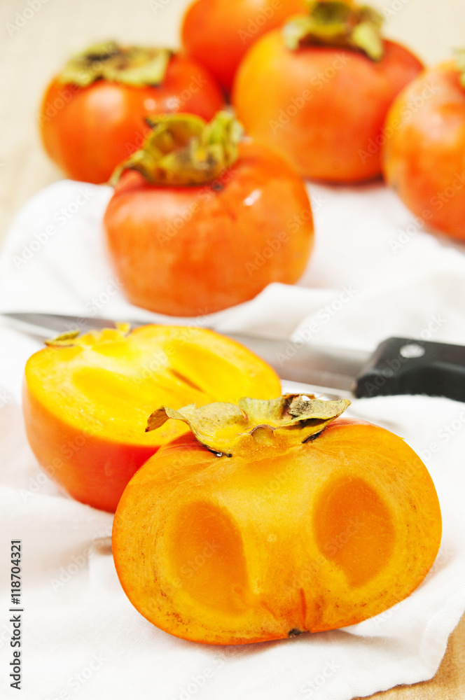 persimmons on a white table