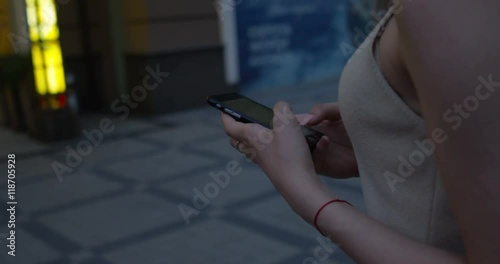 Young woman walking hands using smartphone to text message