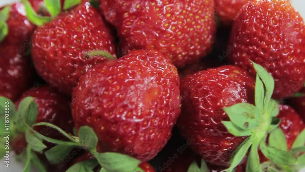 Strawberries in white mask, rotate video in motion Strawberries in white mask, rotate video in motion