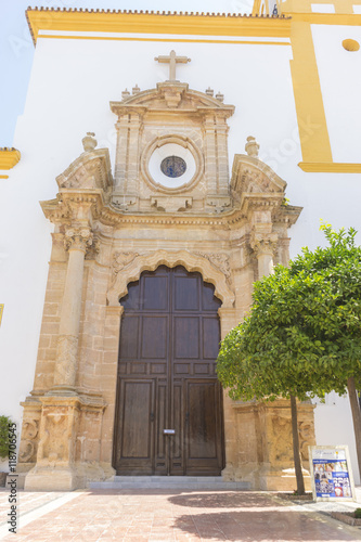 church facade with yellow trim in Marbella, Andalucia Spain