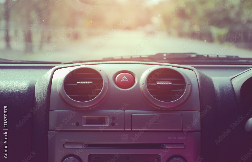 Fototapeta premium Console panel of the car and sun rays.
