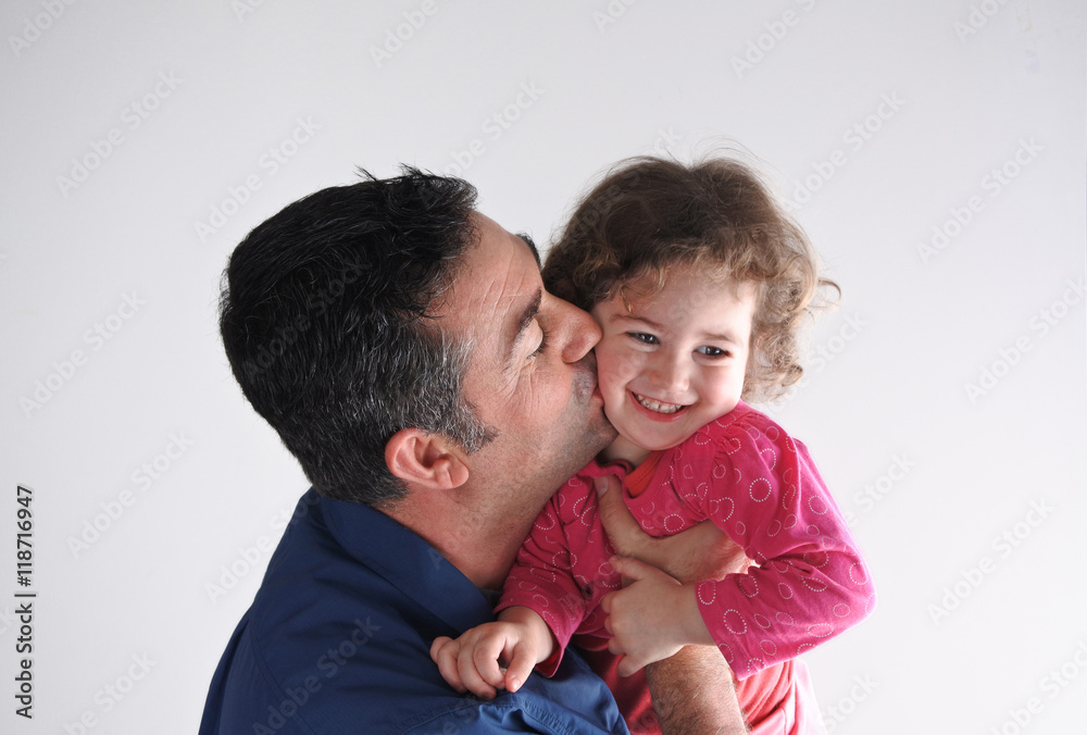 Father kisses his daughter