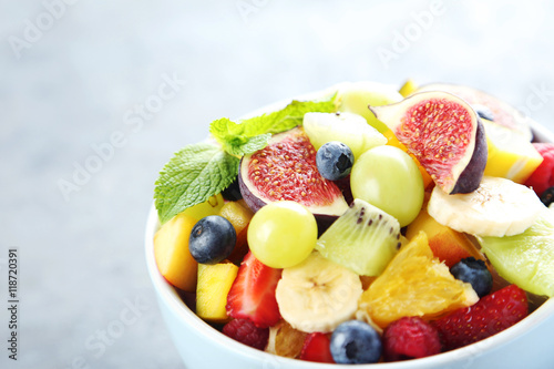 Fresh fruit salad on a grey wooden table