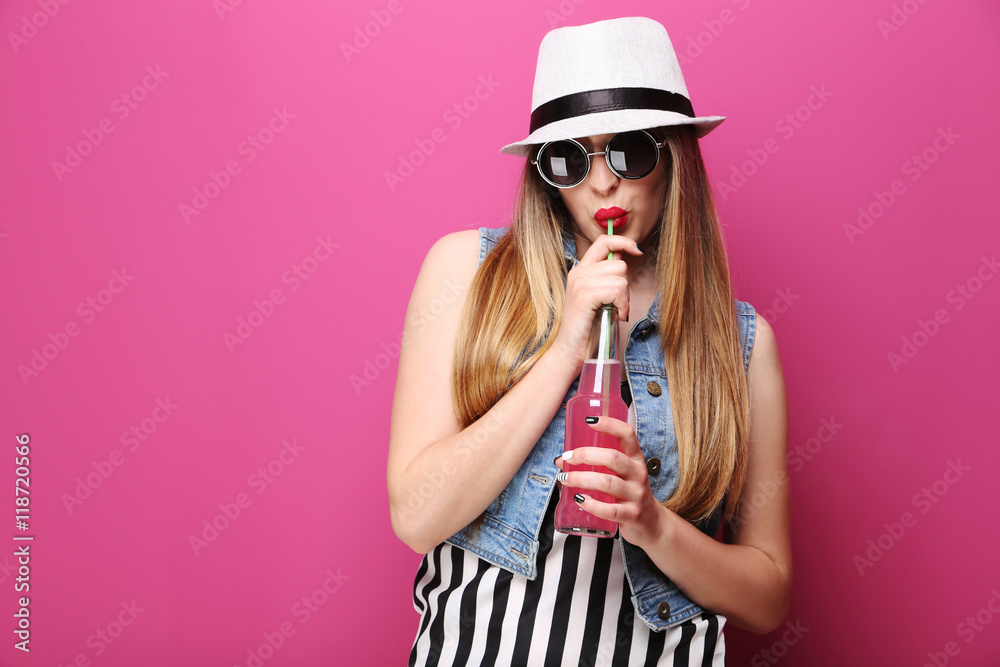 Portrait of a beautiful hipster girl on pink background Portrait of a beautiful hipster girl on pink background