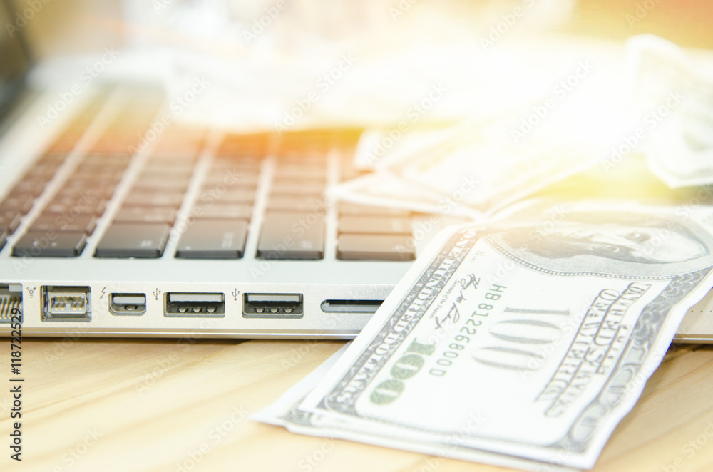 Obraz premium keyboard and money, a place for records, business plan, money background, hundred dollar bills front side.