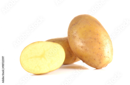 Fresh potatoes full ball and cut half on white background.