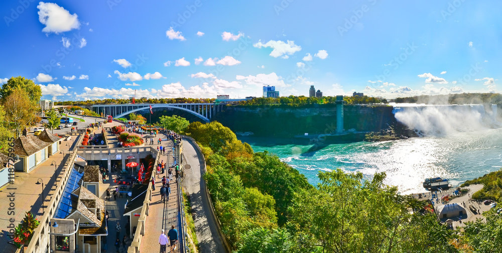 View of the Niagara Falls and Rainbow Bridge across USA and Canada in autumn