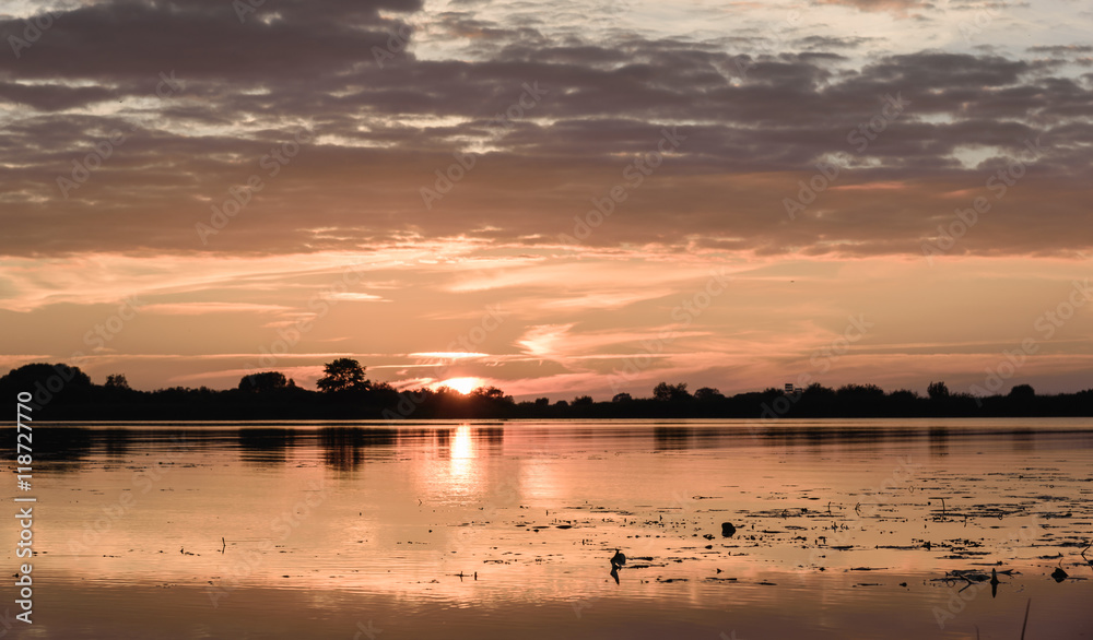 summer sunset on the lake after rain summer sunset on the lake after rain