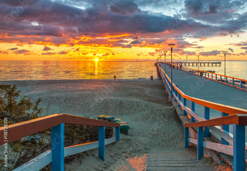 Colorful sunset at a famous marine pier in the Baltic resort city of Palanga, Lithuania, Europe