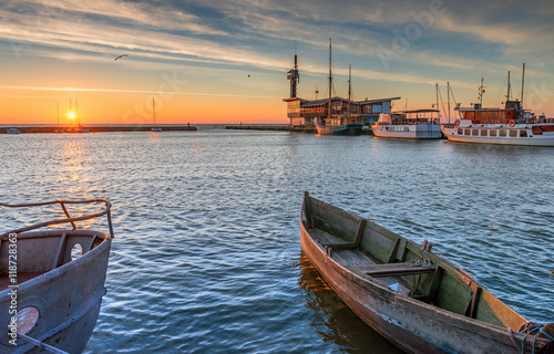 Pleasure and fishing boats docked at harbor of a famous resort city of Nida, ...