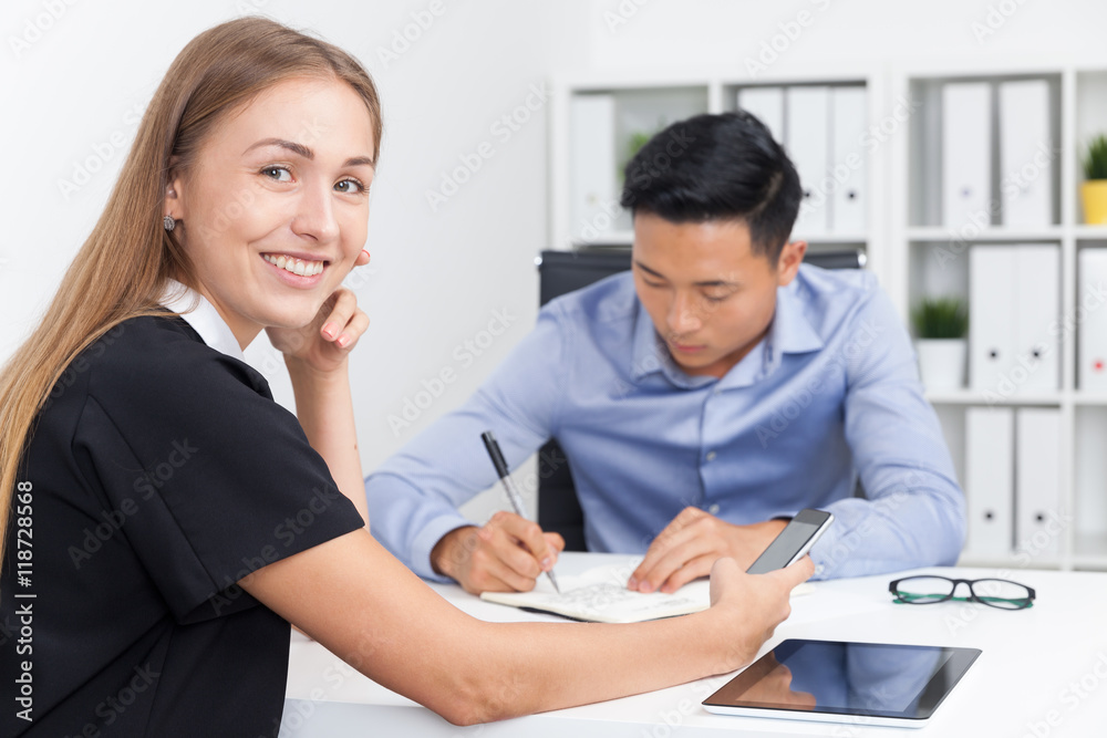 Businesswoman talking on phone in office Businesswoman talking on phone in office