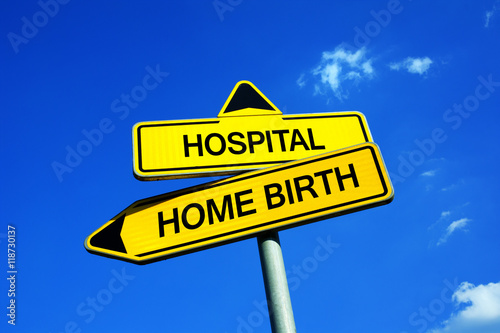 Hospital or Home Birth - Traffic sign with two options - Planned assisted childbirth with midwife at home vs delvery with obstetrician at clinic. Question of danger and safety of mother and child photo