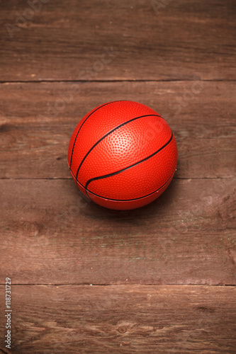 Children rubber basketball on a wooden background © toomler