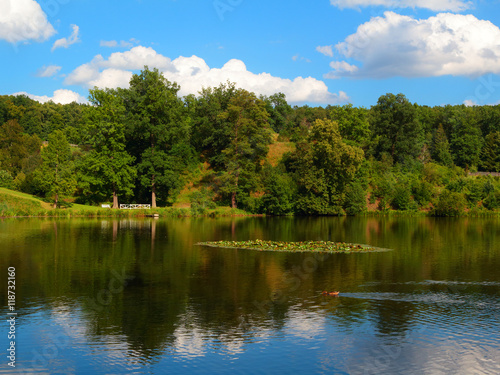 Lake in natural park. Countryside landscape with carp breeding ponds. Colorful nature background.