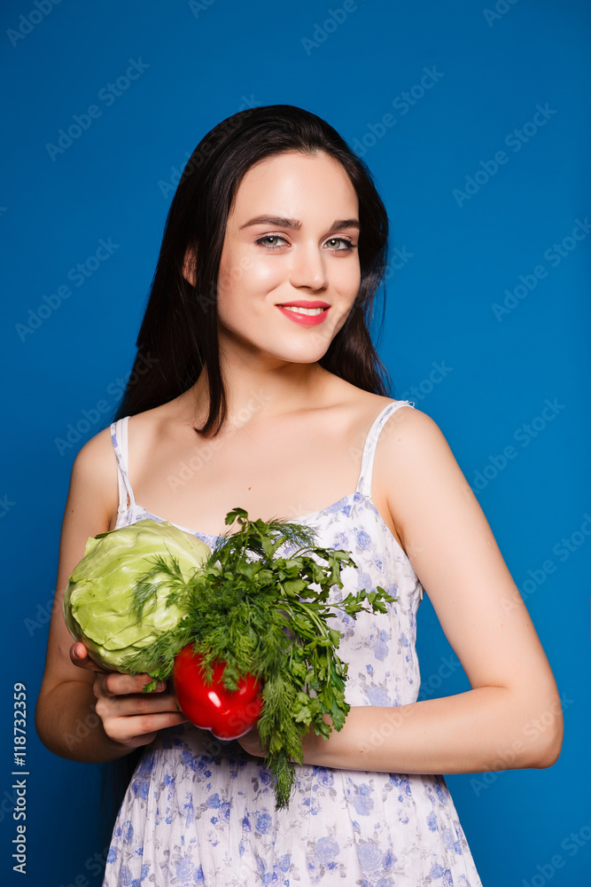 beautiful sweet girl in a simple dress holding a cabbage and cen beautiful sweet girl in a simple dress holding a cabbage and cen