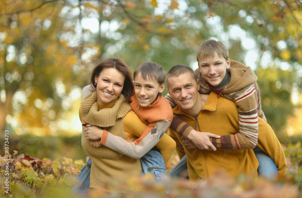 Happy family in autumn forest