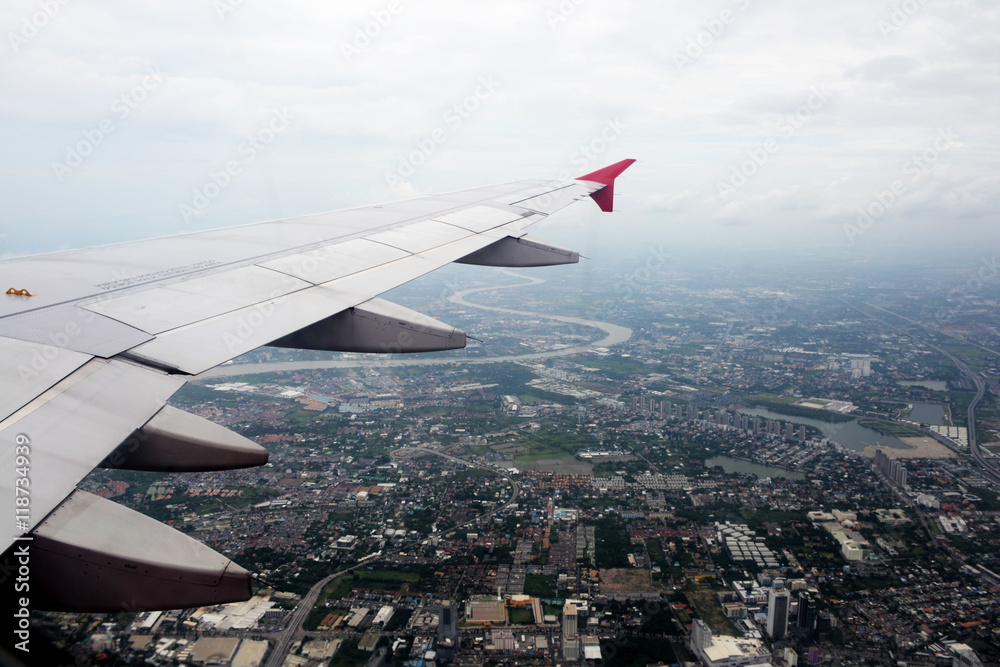 window of jet plane with blue sky and city view window of jet plane with blue sky and city view