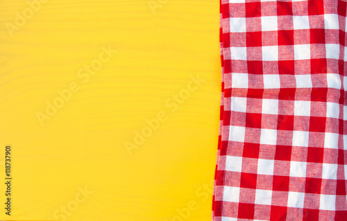 Red napkin at yellow wooden table