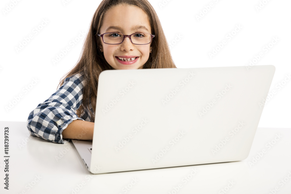 Little girl working with a laptop Little girl working with a laptop