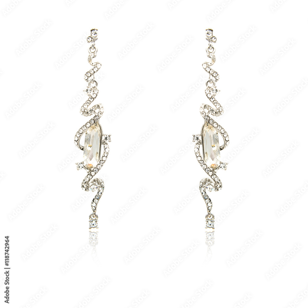 Pair of silver diamond earrings isolated on white Pair of silver diamond earrings isolated on white