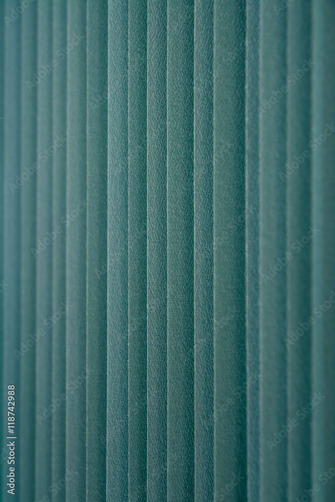 Fototapeta premium Green vertical textile window blinds.