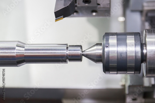 Steel metal cutting machine process by CNC lathe in workshop