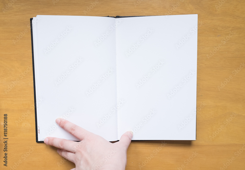 Empty page in sketchbook with hand Empty page in sketchbook with hand